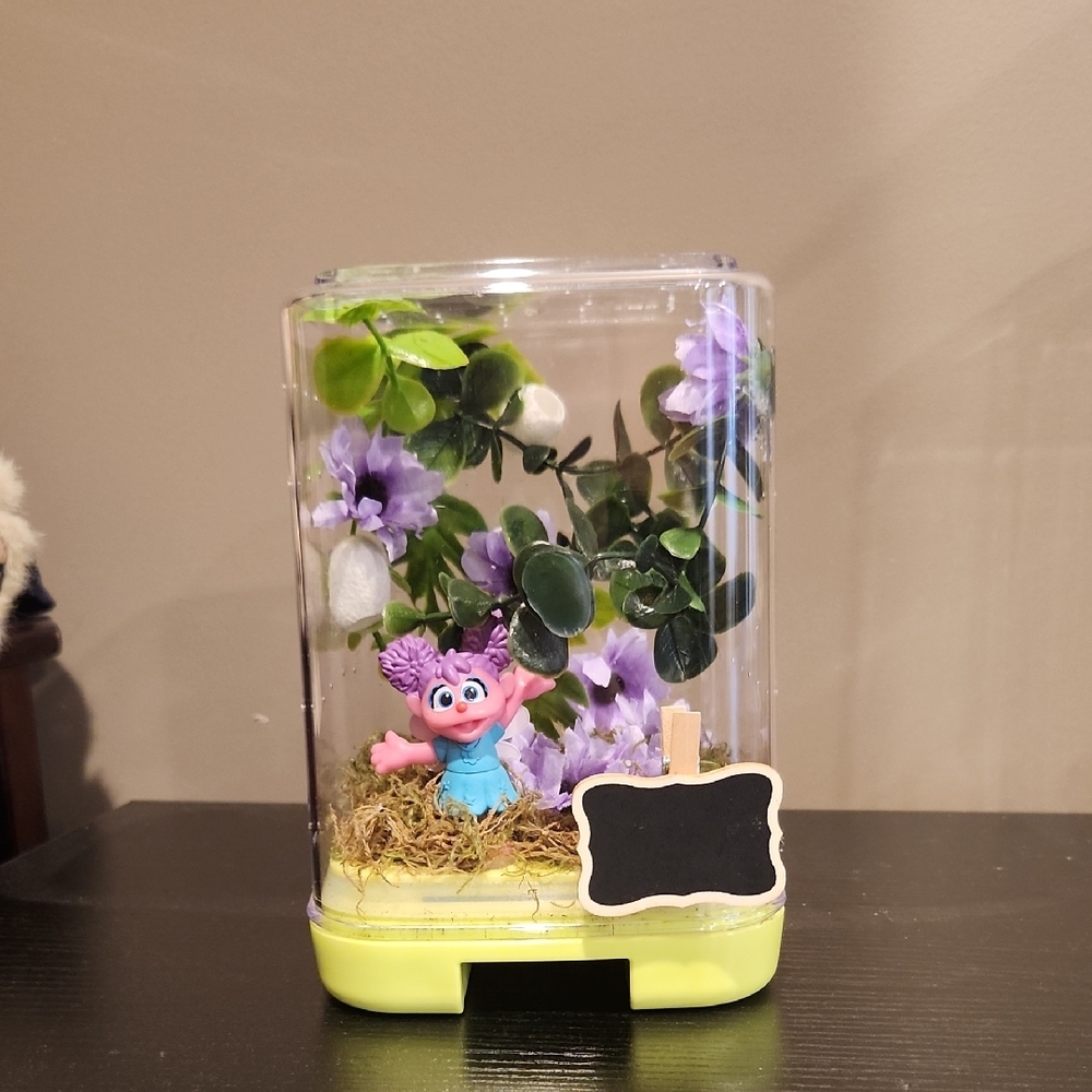 Decorative Terrarium with Purple Flowers and Figurine